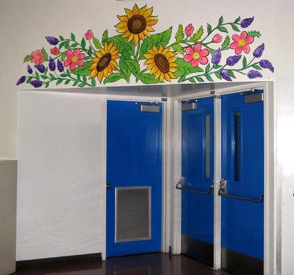 Floral design above school cafeteria doors - Mural Mural On The Wall, Inc.
