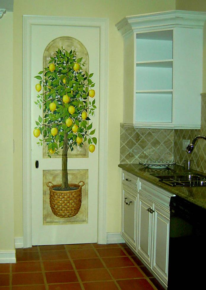 Lemon tree painted on a kitchen door by Mural Mural On The Wall, Inc.